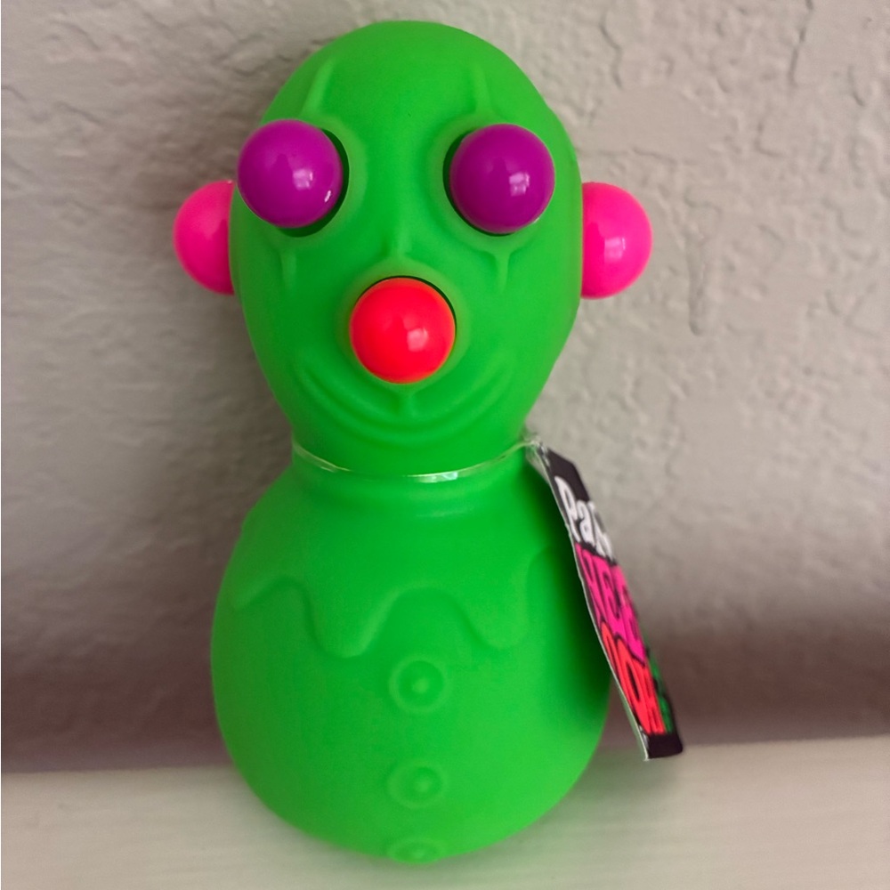 Brand new NeeDoh “Panic Pete” Green Clown Squishie Toy. NWT. Rare & Hard to find